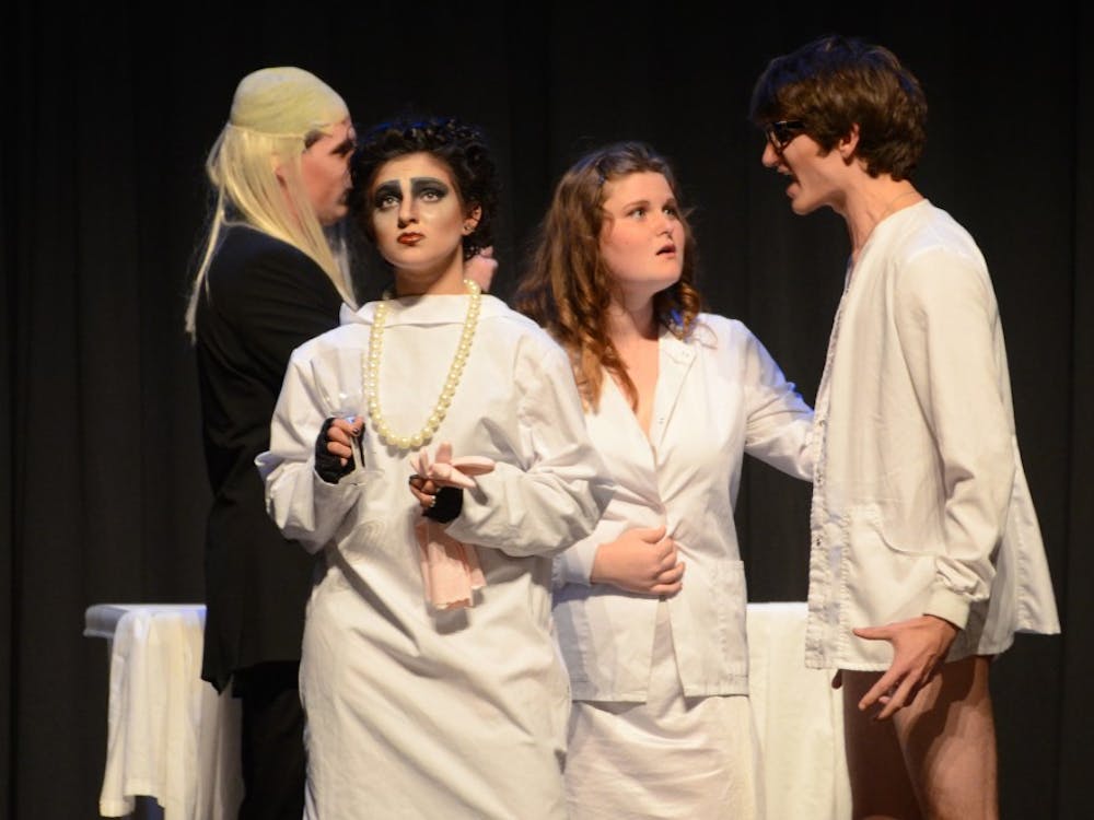 Starting to worry the character Brad lashes out at Frank N. Furter during the Rocky Horror Picture Show on Oct. 31 at John R. Emens Auditorium. DN PHOTO KAYLEEN BAKER