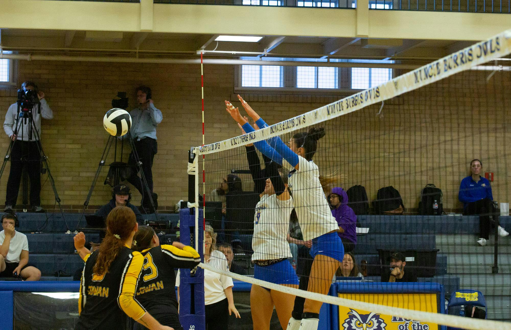 Cowan senior outside hitter Mylie Williams (#13) recovers to save a point after a block from Burris on Aug. 28 at Ball Gymnasium. Williams leads the team on kills per set with 1.5. Kyle Stout, DN