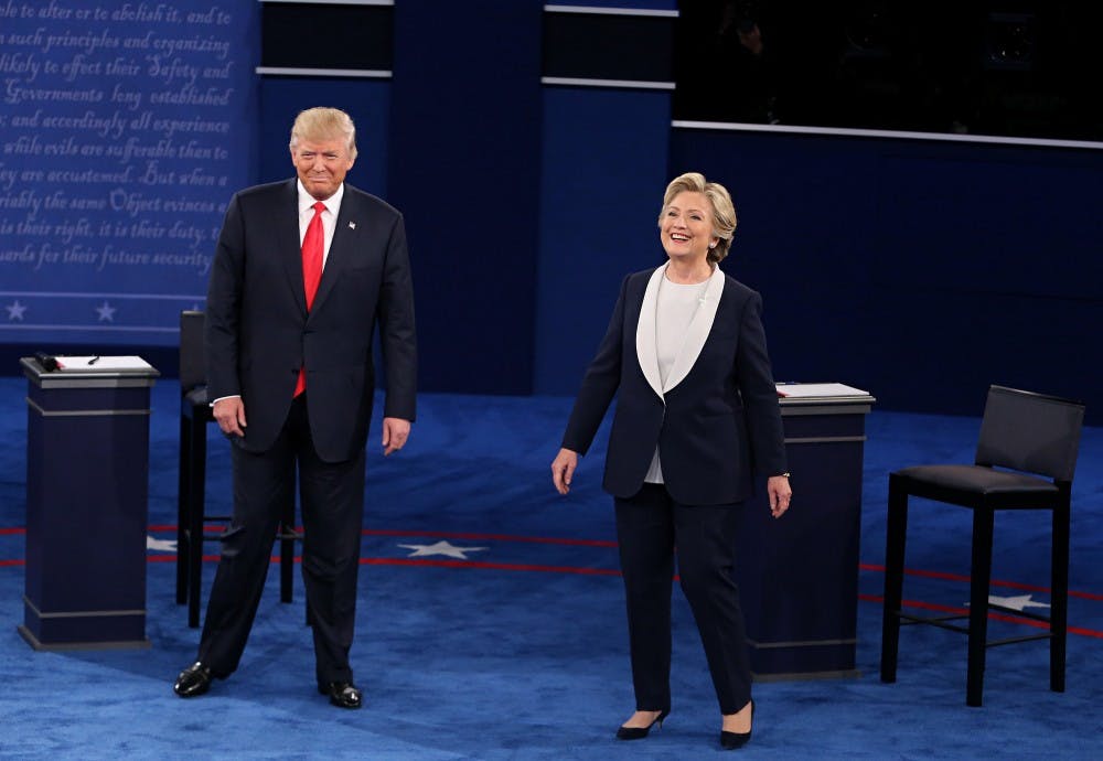 Donald Trump and Hillary Clinton take the stage at the start of the second debate between the Republican and Democratic presidential candidates on Sunday, Oct. 9, 2016 at Washington University in St. Louis, Mo. (Christian Gooden/St. Louis Post-Dispatch/TNS)
