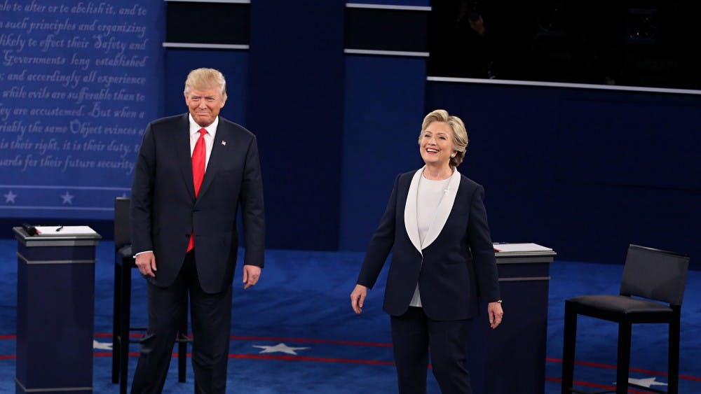 Donald Trump and Hillary Clinton take the stage at the start of the second debate between the Republican and Democratic presidential candidates on Sunday, Oct. 9, 2016 at Washington University in St. Louis, Mo. (Christian Gooden/St. Louis Post-Dispatch/TNS)