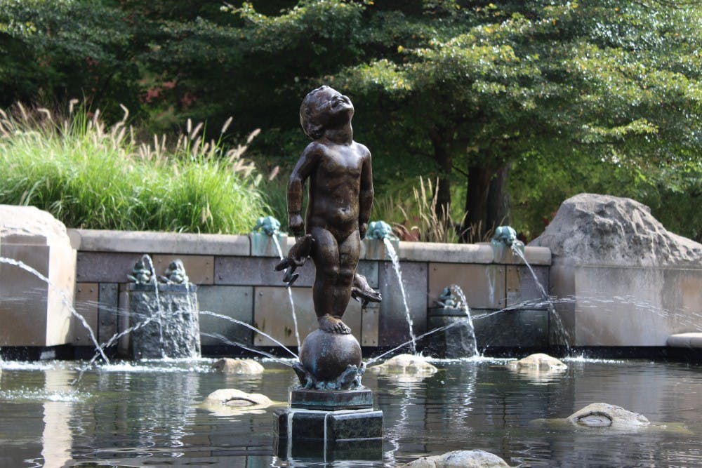 <p>Frog Baby stands in the fountain Thursday, Aug. 30, 2018, outside of Bracken Library. <strong>Brooke Kemp, DN</strong></p>