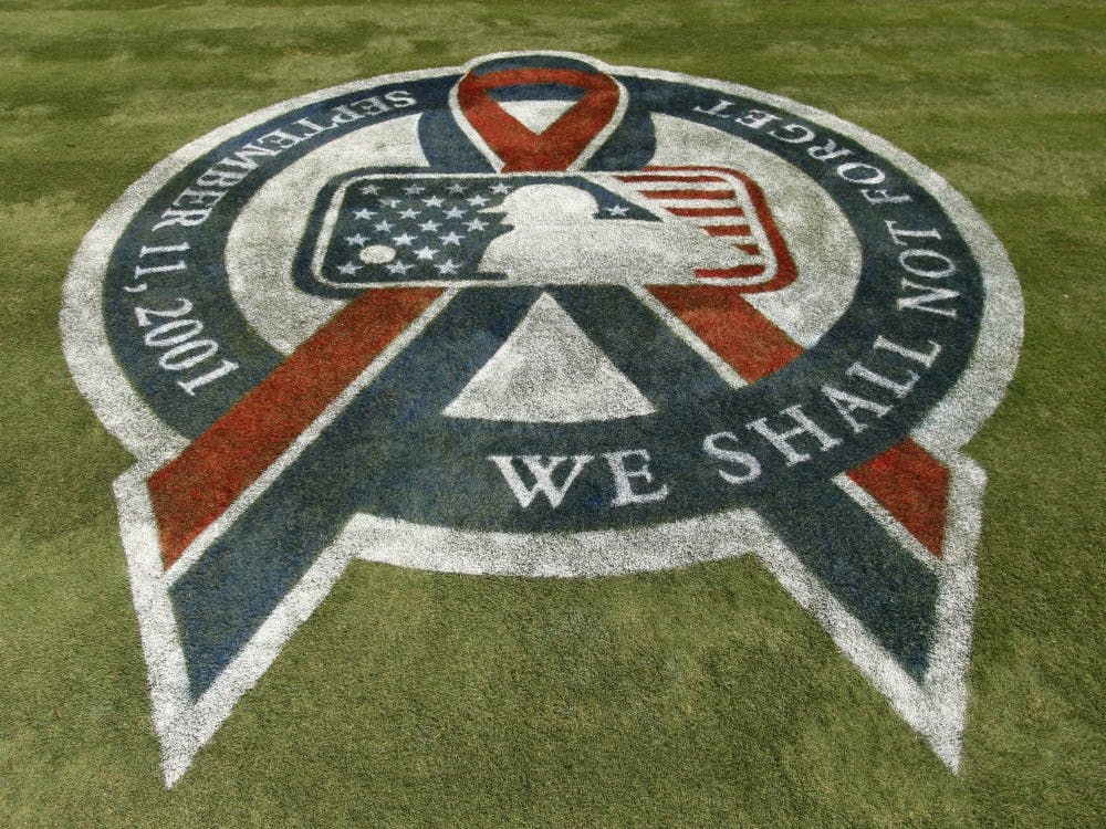 A 9/11 commemorative logo is visible on the field  as the Texas Rangers beat the Oakland Athletics 8-1, eliminating the A's from the playoffs, Sunday, September 11, 2011 in Arlington, Texas. (Richard W. Rodriguez/Fort Worth Star-Telegram/MCT/TNS)