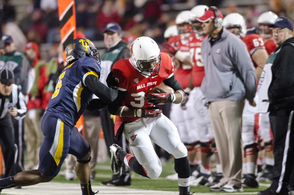 Sophomore running back Jahwan Edwards crosses the line to score a touchdown for Ball State. Edwards broke 1,000 rushing yards for the season during the game against Toledo. He was the first Ball State running back to do so since 2008. DN PHOTO COREY OHLENKAMP