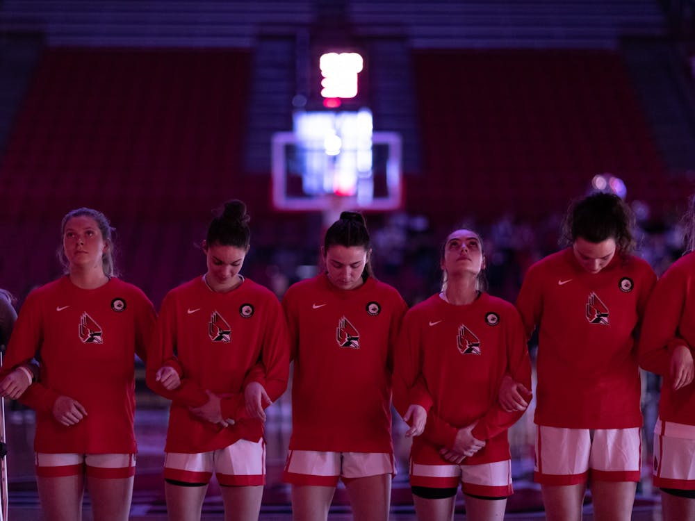 Members of the Ball State Women's Basketball team stand with their arms interlocked before their game against Eastern Michigan University Mar. 5 at Worthen Arena. The Cardinals stong offense led them to a 92-58 victory over Eastern Michigan. Eli Houser, DN