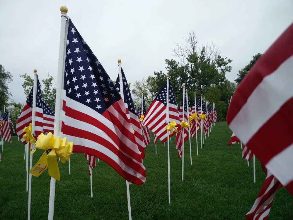 <p>Flags stand outside Saturday, Sept. 8,2018, outside Minnetrista in Muncie. People can donate 30 dollars to buy a yellow ribbon to put on a flag in remembrance of a veteran. <strong>Rohith Rao, DN</strong></p>