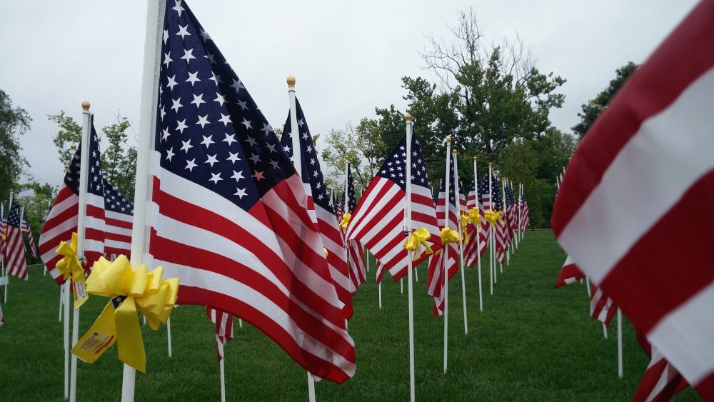 Flags stand outside Saturday, Sept. 8,2018, outside Minnetrista in Muncie. People can donate 30 dollars to buy a yellow ribbon to put on a flag in remembrance of a veteran. Rohith Rao, DN
