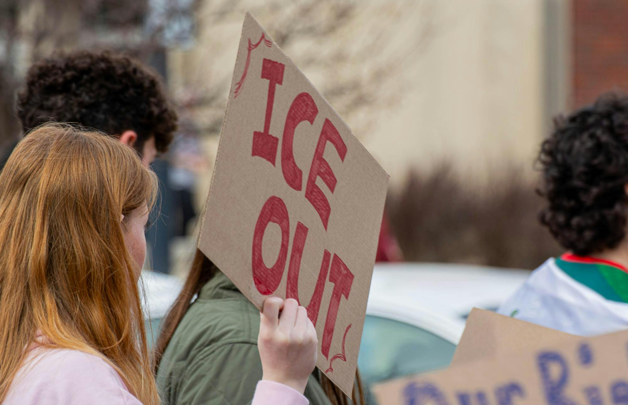 One of the students holds out a sign that reads 'ICE OUT' in the ocean of similar signs. Feb. 17 Ball State University. Aiden Murray, NLI.