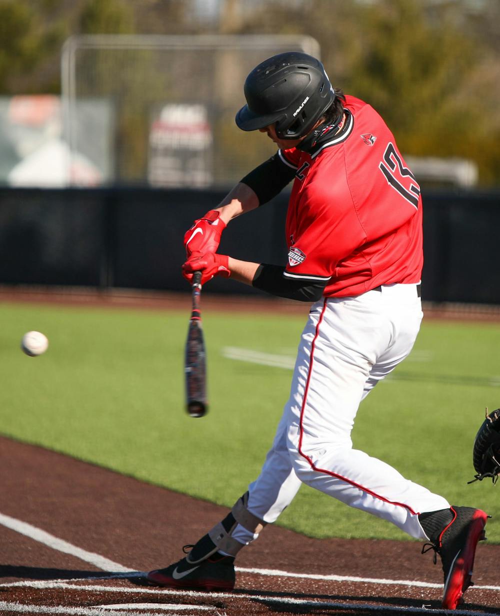 Junior first baseman Trenton Quartermaine hits the ball March 20, 2021, at First Merchants Ballpark. The Cardinals won their second game of the day 3-2 against Western Michigan. Jaden Whiteman, DN