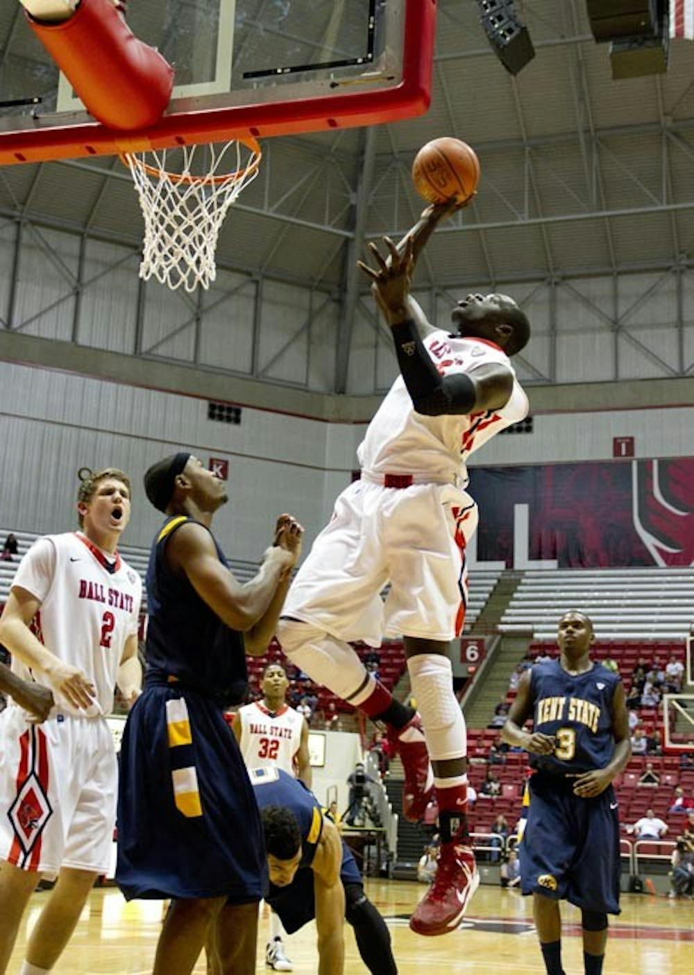 Junior forward Majok Majok reaches to catch a rebound in Worthen Arena on Jan. 12 against Kent State. The Cardinals were able to get ahold of the ball more by getting more rebounds than the Golden Flashes 48-39. DN PHOTO EMMA FLYNN