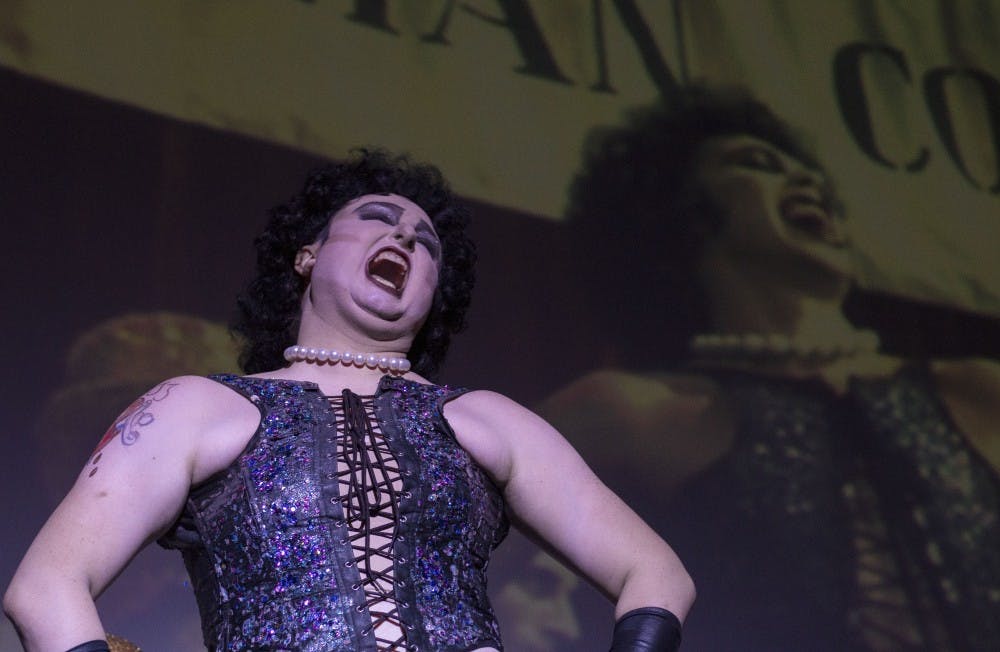 Actors apart of the the Old Queens Men shadow cast returns for the fifth annual showing of The Rocky Horror Picture Show Sept. 29, 2018, in Downtown Muncie at Cornerstone Center for the Arts. The show featured the classic film and interactive cast dancing through the audience and on stage. Grace Hollars, DN