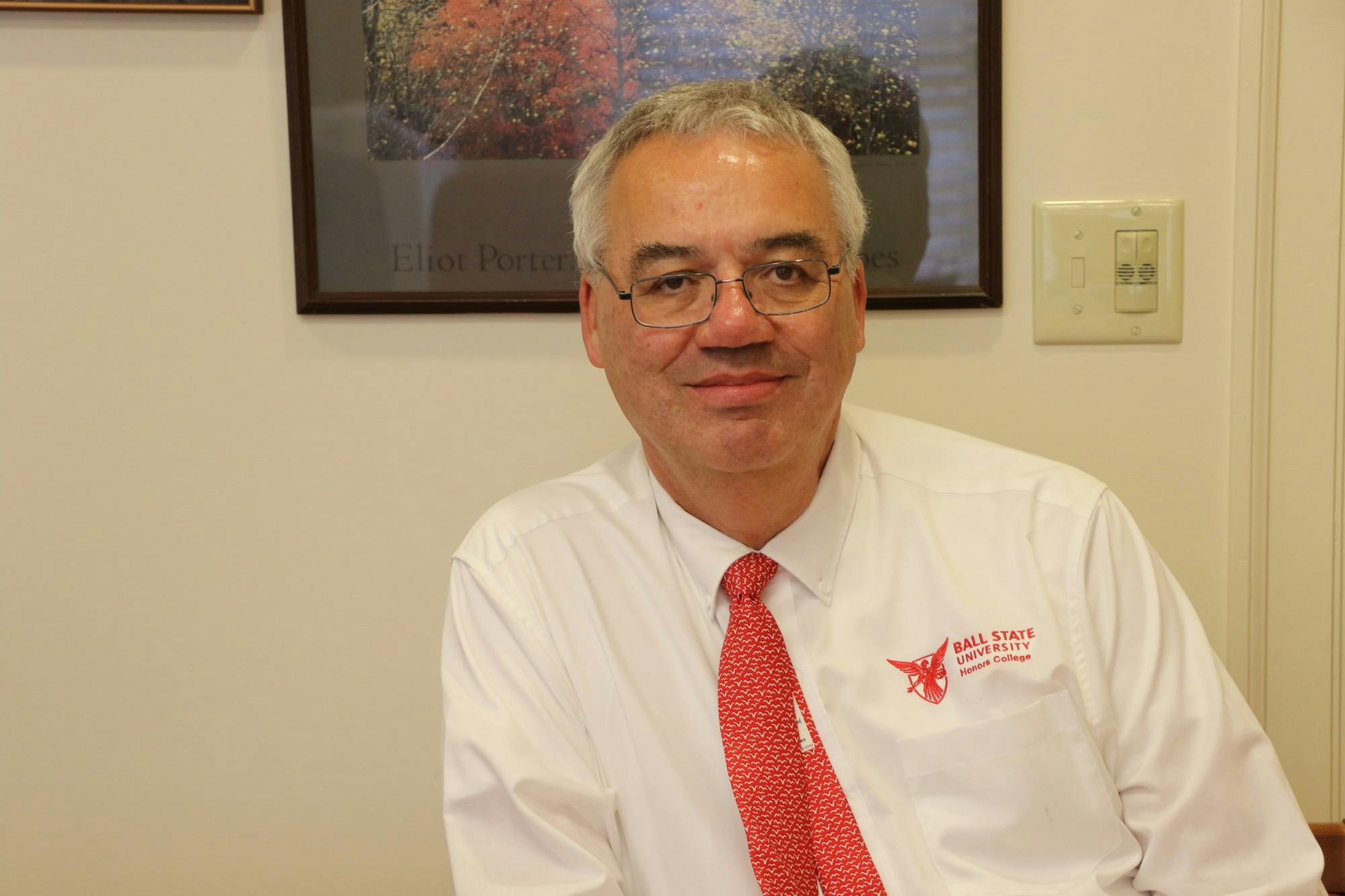Dean of the Honors College John Emmert poses for a portrait inside his office Oct. 25. Emma Matlock, DN