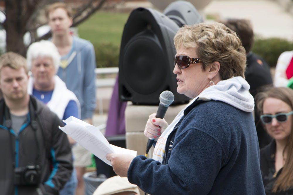 Judy Proctor, a Ball State alumna, speaks during the Out of the Darkness Walk on April 6. Proctor lost her son to suicide in 2009. DN PHOTO TAYLOR IRBY