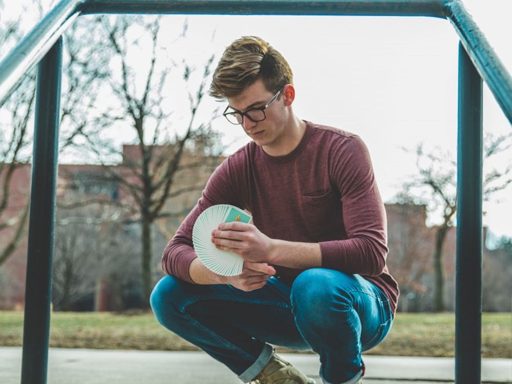 Junior telecommunications major Nate Lex does cardistry with the Peelers deck of Organic Playing Cards in 2018. Lex began cardistry in 2013 as a way to channel his energy because he said he has ADHD and has always been fidgety. Cameron Toner, Photo Provided. 