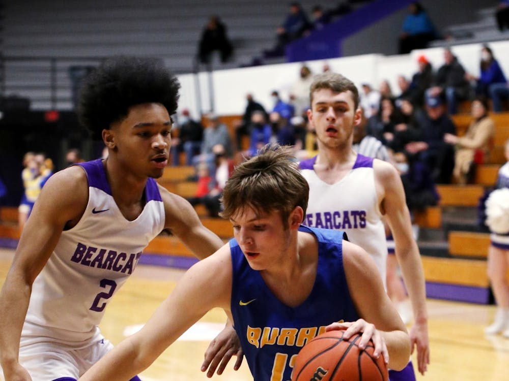 Connor McKibben (13) dribbles the ball towards the basket against Muncie Central Bearcats at the Inaugural City of Champion Basketball Invitational on Jan. 29, 2022, at Muncie Fieldhouse in Muncie, IN. Amber Pietz, DN