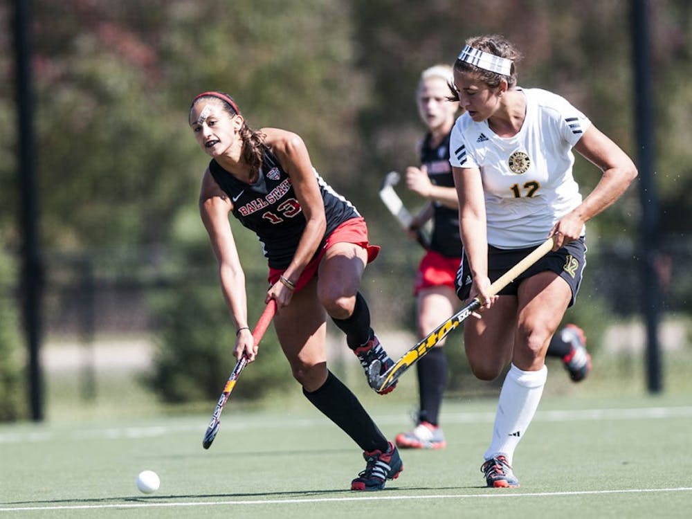 Sophomore midfielder Bianca Velez searches for an open teammate as she makes a push downfield against Vermont on Sept. 28. DN PHOTO JONATHAN MIKSANEK