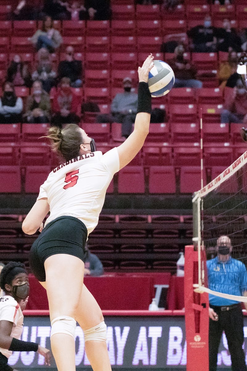 Sophomore middle blocker Marie Plitt spikes the ball Feb. 12, 2021, in John E. Worthen Arena. The Cardinals lost to the Falcons 0-3. Madelyn Guinn, DN