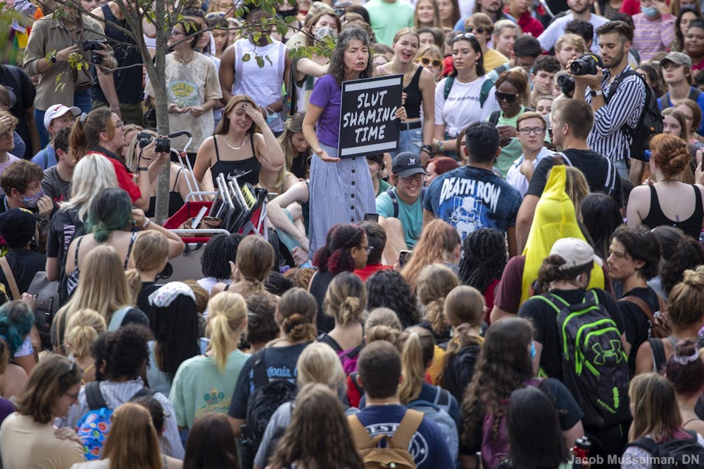 <p>“Sister Cindy” Smock speaks to a crowd of students at her “Ho no mo” rally Sept. 17, 2021, at the Quad. Smock and her husband, “Brother Jed,” travel the country going to different colleges and preaching their beliefs. <strong>Jacob Musselman, DN</strong></p>
