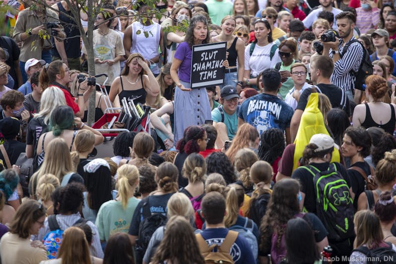 “Sister Cindy” Smock speaks to a crowd of students at her “Ho no mo” rally Sept. 17, 2021, at the Quad. Smock and her husband, “Brother Jed,” travel the country going to different colleges and preaching their beliefs. Jacob Musselman, DN