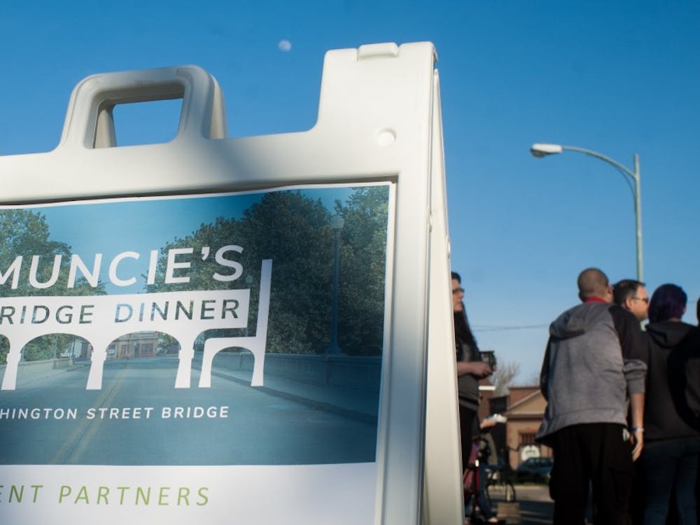Community members gathered on the Washington Street Bridge April 26 for the annual Muncie's Bridge Dinner for food, drinks, art and live music. This was the second Muncie's Bridge Dinner.