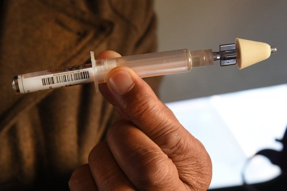 Thomas Clemons shows how to use naloxone, also called Narcan, to reverse heroin overdoses to addicts who visit a Baltimore City needle exchange van. Delaware County has seen an increase in heroin usage. TNS photo