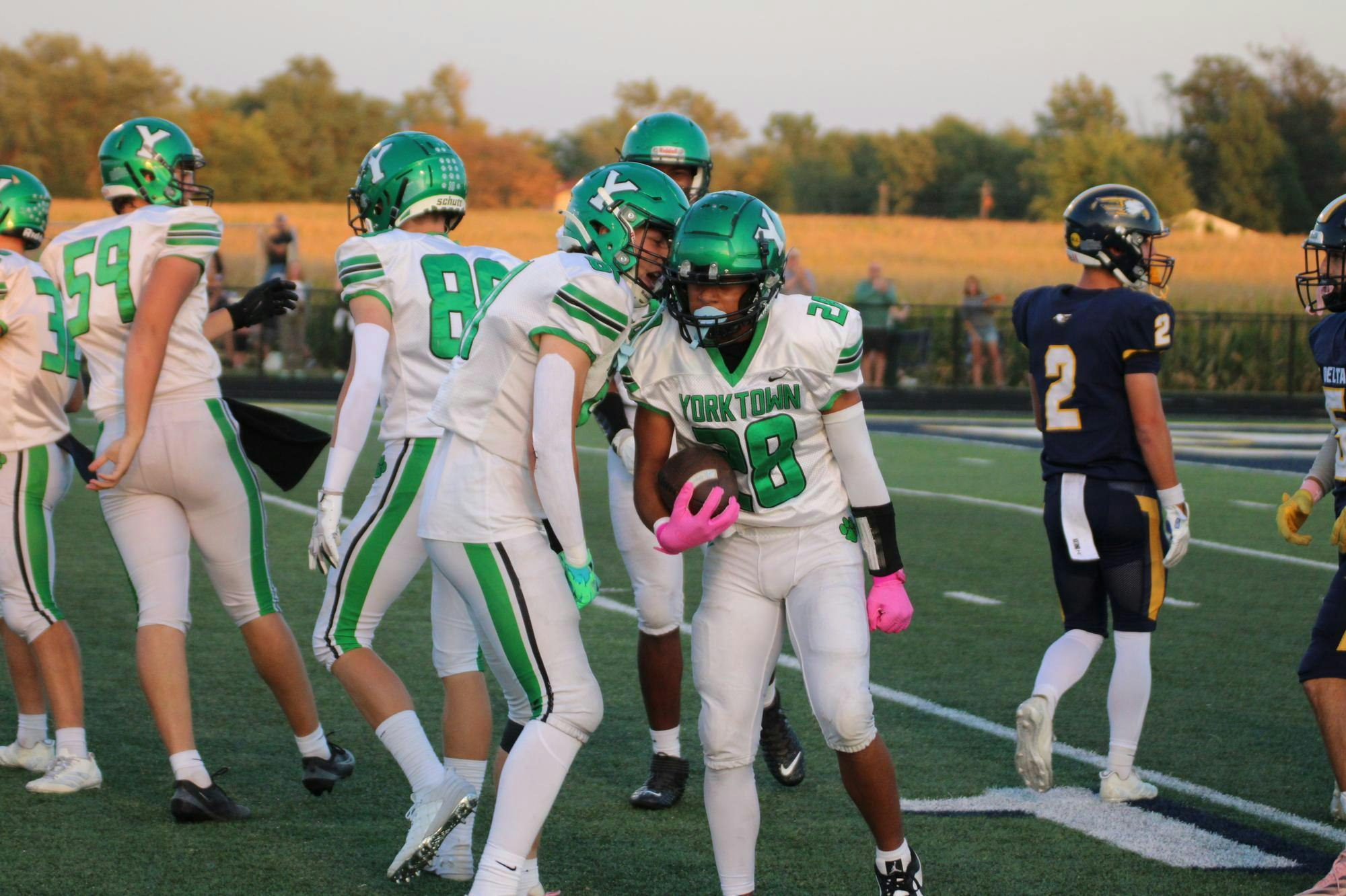 Kayden Crumes and Cole Perdue celebrate after a first down run. The Tigers totaled more than 500 yards of total offense against the Eagles. Photo by Aiden Riegle