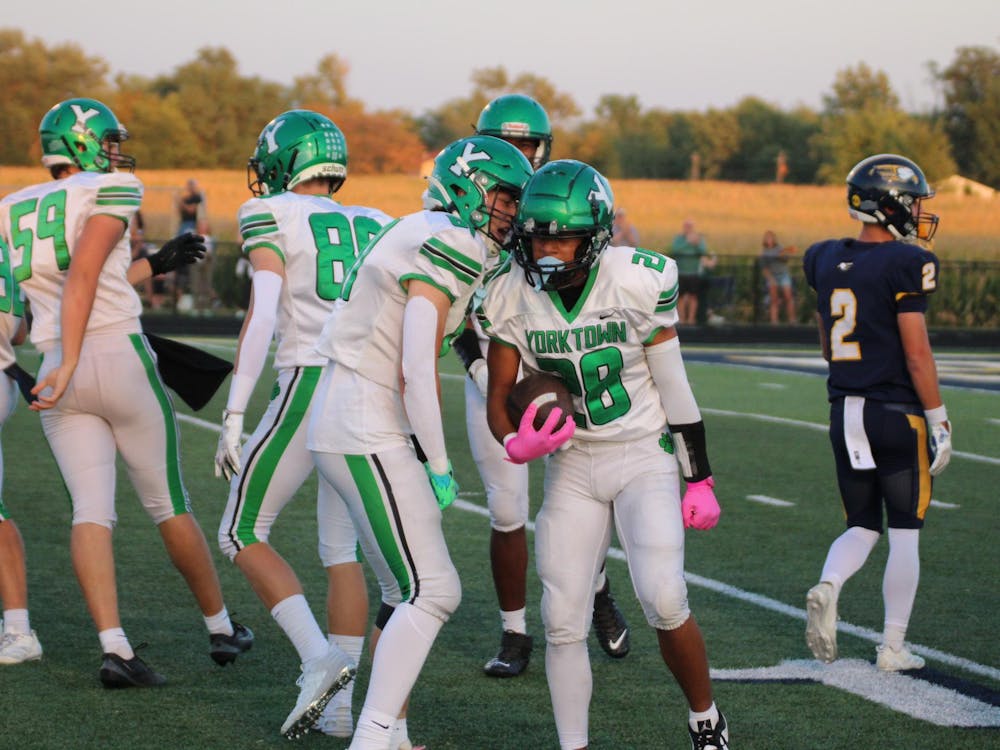 Kayden Crumes and Cole Perdue celebrate after a first down run. The Tigers totaled more than 500 yards of total offense against the Eagles. Photo by Aiden Riegle