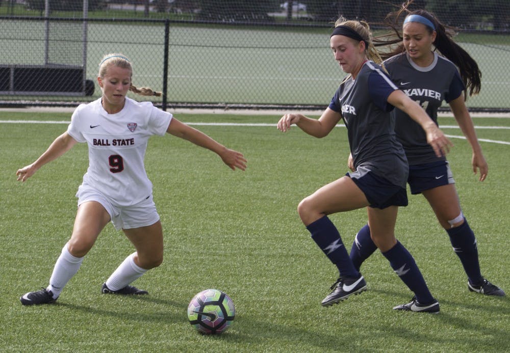 Junior midfielder/forward Allison Abbe fights for the ball during women's soccer's Aug. 25 match against Xavier University. Ball State tied 1-1 after a double overtime. Kara Berg // DN