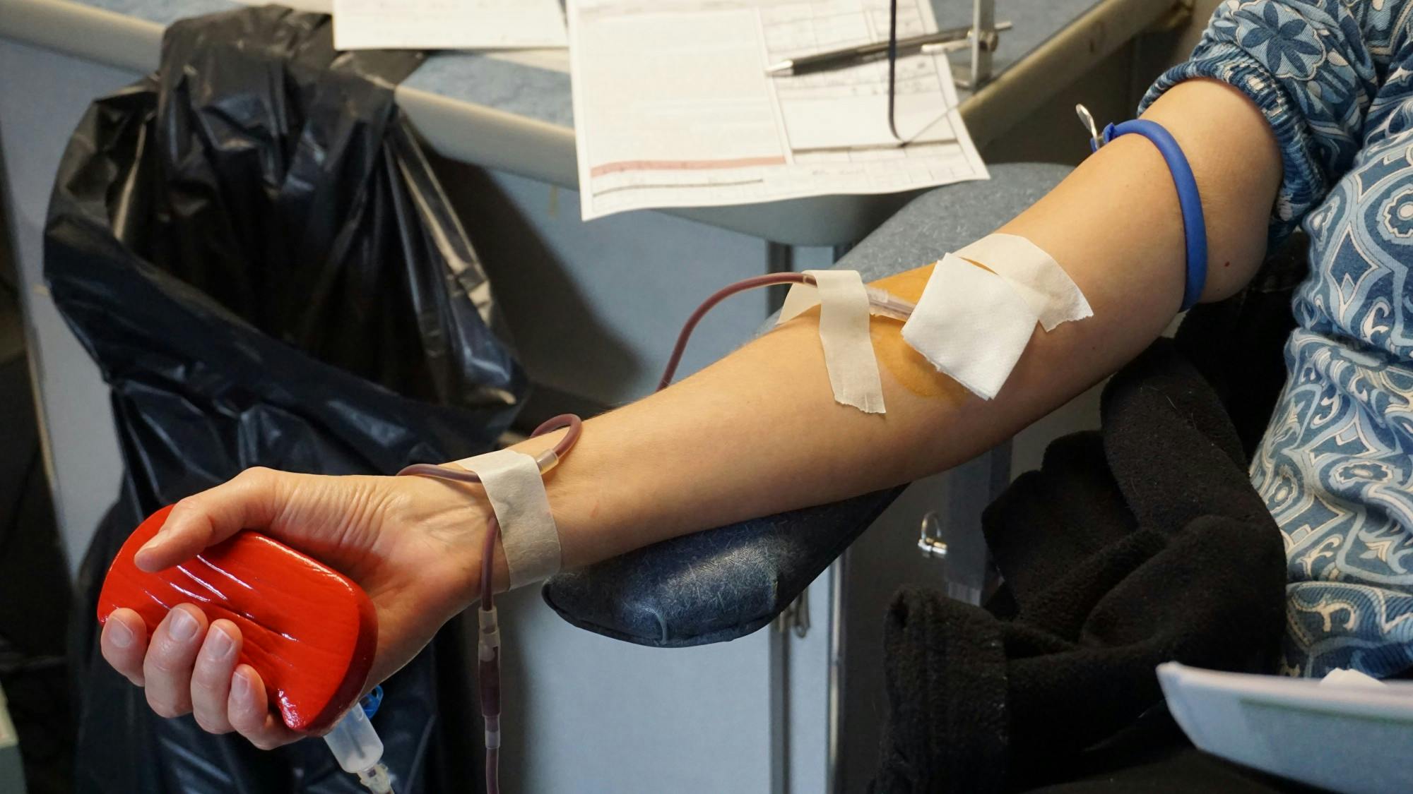 Dagney Faulk,  economist and director of research at the Ball State’s Center for Business and Economic Research, pumps blood at Versiti Blood Center of Indiana&#x27;s mobile donation center Oct. 7, 2021. Faulk, who worked with professor Steve Horwitz prior to his passing in June 2021, said she was proud to give blood in his memory. John Lynch, DN