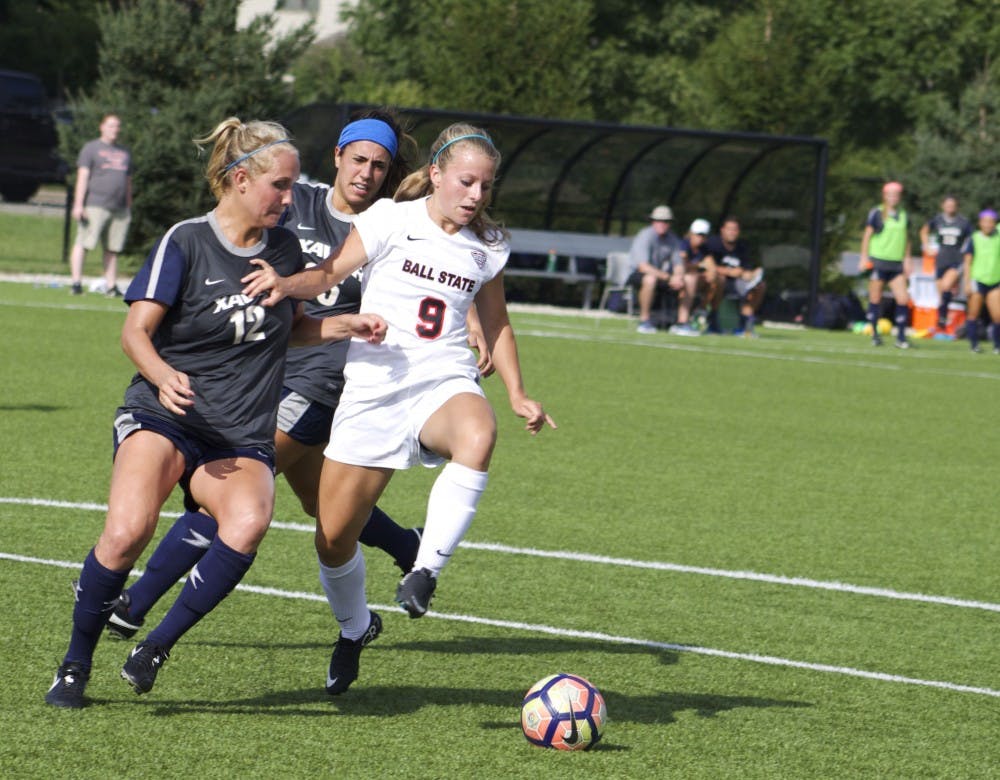 Junior midfielder/forward Allison Abbe fends off attackers from the rival team, Xavier University, during their match Aug. 25. Ball State tied 1-1 after a double overtime. Kara Berg // DN