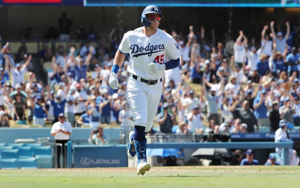 Fans cheer as Los Angeles Dodgers' Matt Beaty (45) runs the bases after hitting a two-run home run to give the Dodgers  the lead against the San Francisco Giants in the fourth inning on Sunday, Sept. 8, 2019 at Dodger Stadium in Los Angeles, Calif. (Gina Ferazzi/Los Angeles Times/TNS)