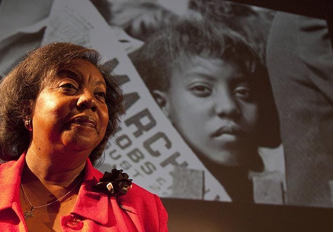 Edith Lee Payne stands in front of an image of herself at the age of 12 taken at the March on Washington after participating in a Black History Month program at the Detroit School of the Arts, February 15, 2012. (Kathleen Galligan/Detroit Free Press/MCT)