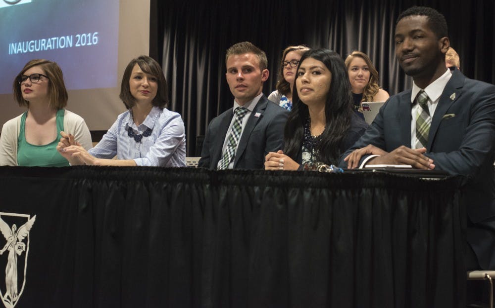 Bailey Loughlin, president pro-tempore; Emily Halley, treasurer; Brock Frazer, secretary; Ana Batres, vice president; and James Wells, president, all sit in the front of the Cardnial Hall C at the L.A. Pittenger Student Center on April 20. DN PHOTO STEPHANIE AMADOR