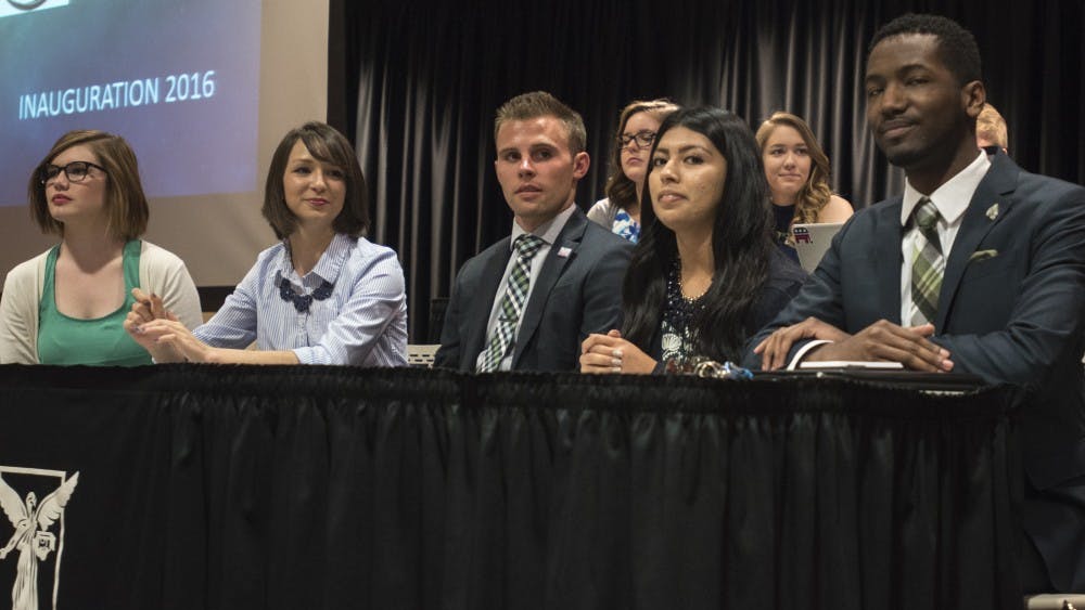 Bailey Loughlin, president pro-tempore; Emily Halley, treasurer; Brock Frazer, secretary; Ana Batres, vice president; and James Wells, president, all sit in the front of the Cardnial Hall C at the L.A. Pittenger Student Center on April 20. DN PHOTO STEPHANIE AMADOR