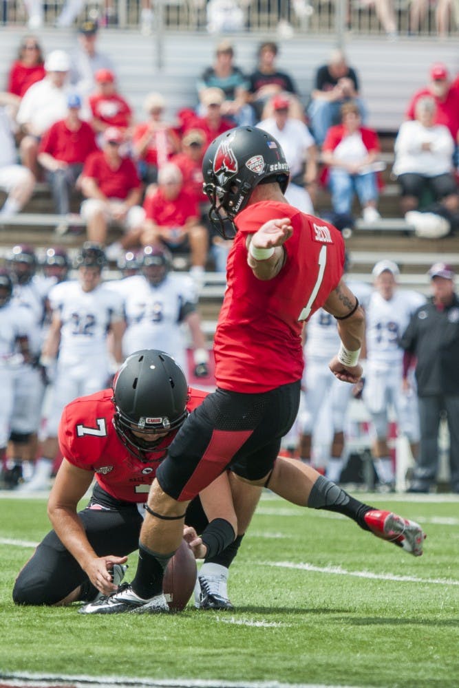 Senior Scott Secor attempts a field goal during the game against Colgate on Aug. 30 at Scheumann Stadium. DN PHOTO JONATHAN MIKSANEK