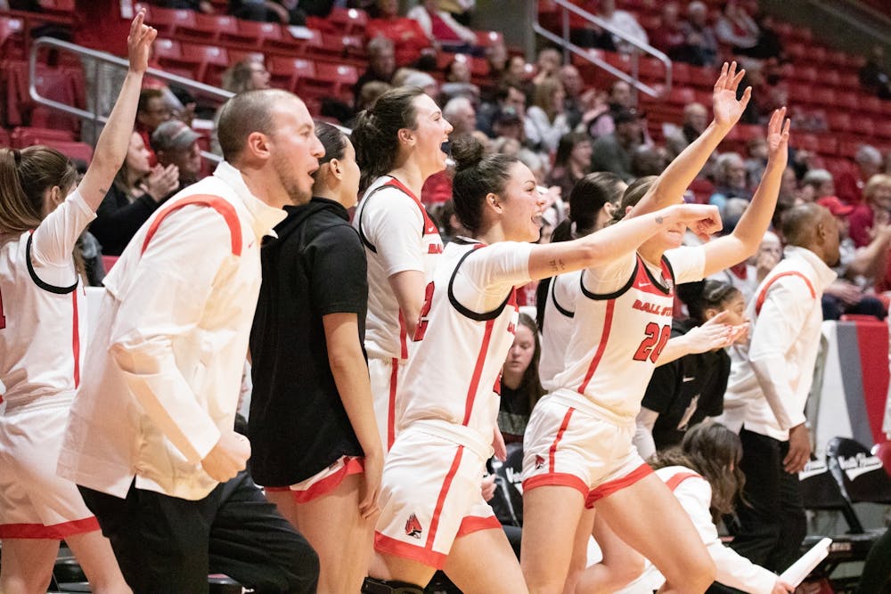 The Ball State Women's Basketball team celebrates from the sideline during a game against Northern Illinois Feb. 1 at Worthen Arena. Brandon Dean, DN