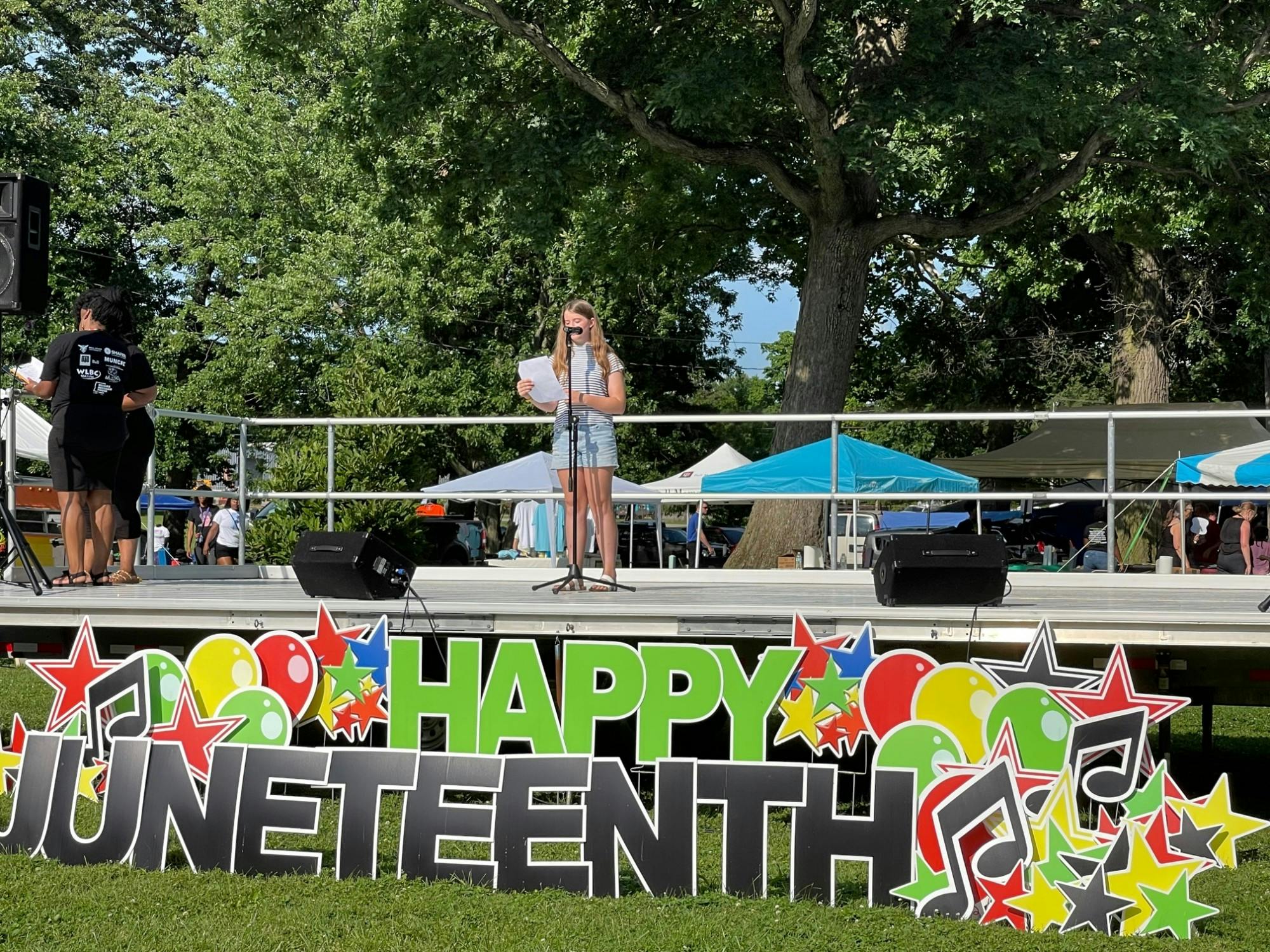 Eden McCrory, Burris Laboratory School sixth-grade student, reads her winning Juneteenth essay to the Muncie community in McCulloch Park July 17, 2021. McCrory won a $100 gift card for her essay responding to the prompt &quot;Why Juneteenth Should Be A National Holiday.” Iris Tello, DN