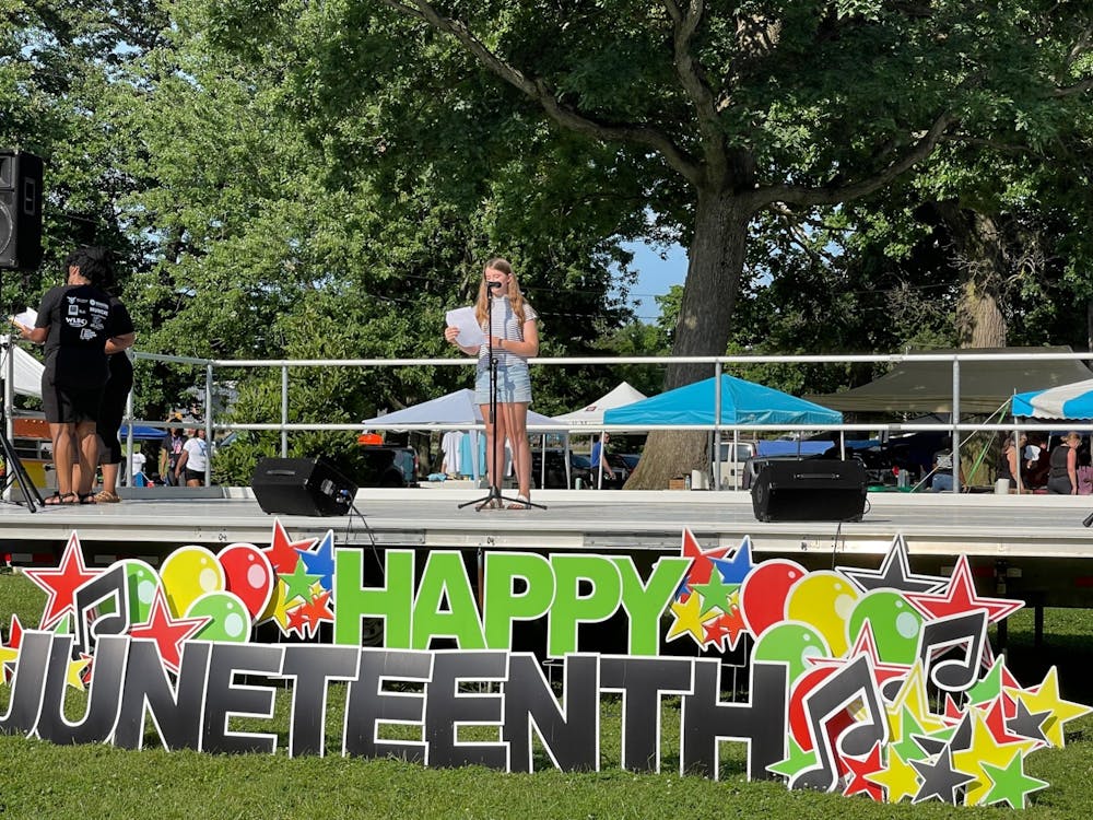 <p>Eden McCrory, Burris Laboratory School sixth-grade student, reads her winning Juneteenth essay to the Muncie community in McCulloch Park July 17, 2021. McCrory won a $100 gift card for her essay responding to the prompt &quot;Why Juneteenth Should Be A National Holiday.” <strong>Iris Tello, DN</strong></p>