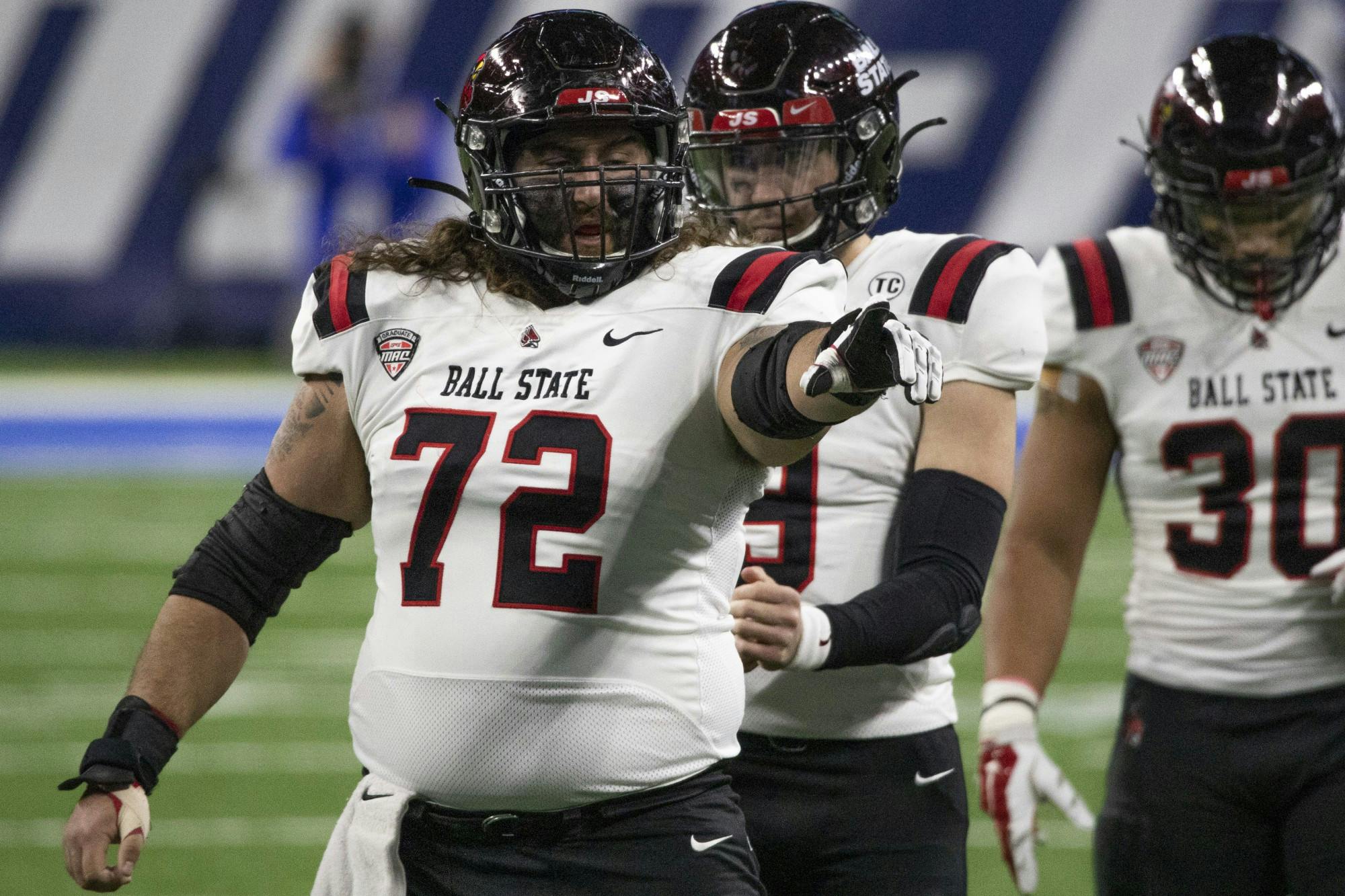 Ball State Cardinals redshirt senior offensive lineman Anthony Todd points at a University at Buffalo defensive lineman Dec. 18, 2020, at Ford Field in Detroit, Mich. The Cardinals beat the University at Buffalo Bulls 38-28. Jacob Musselman, DN 