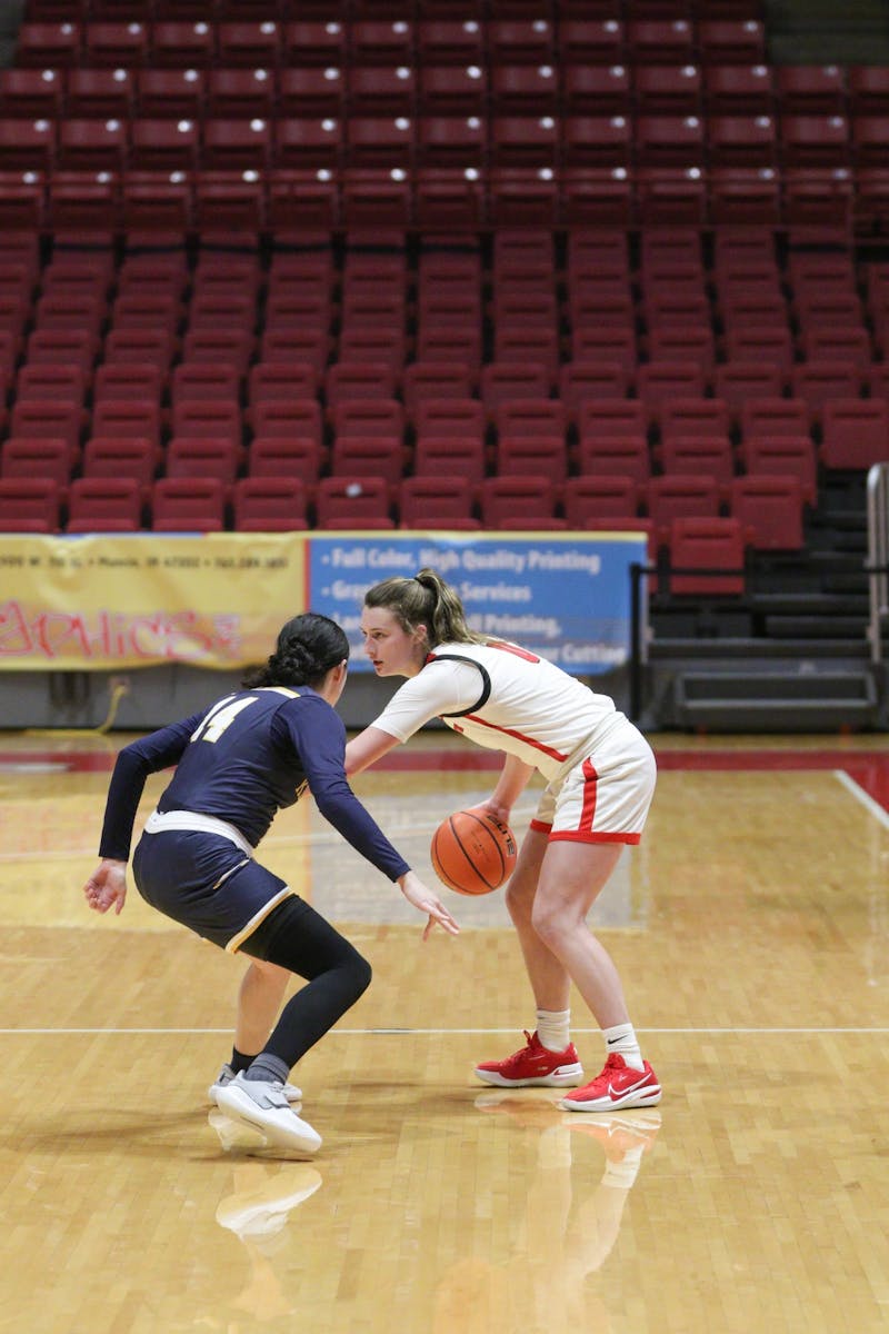 Ball State Freshman Ally Becki dribbles the ball behind the three-point line while guarded by a Kent State defender at Worthern Arena Jan. 9. Becki scored 10 points for the Cardinals during her 24 minutes on the court. Eli Houser, DN