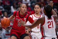 Senior Lachelle Austin goes around two Ohio State players on Dec 10 at Schottenstein Center arena. Ball State is now 6-4. Titus Slaughter, DN.