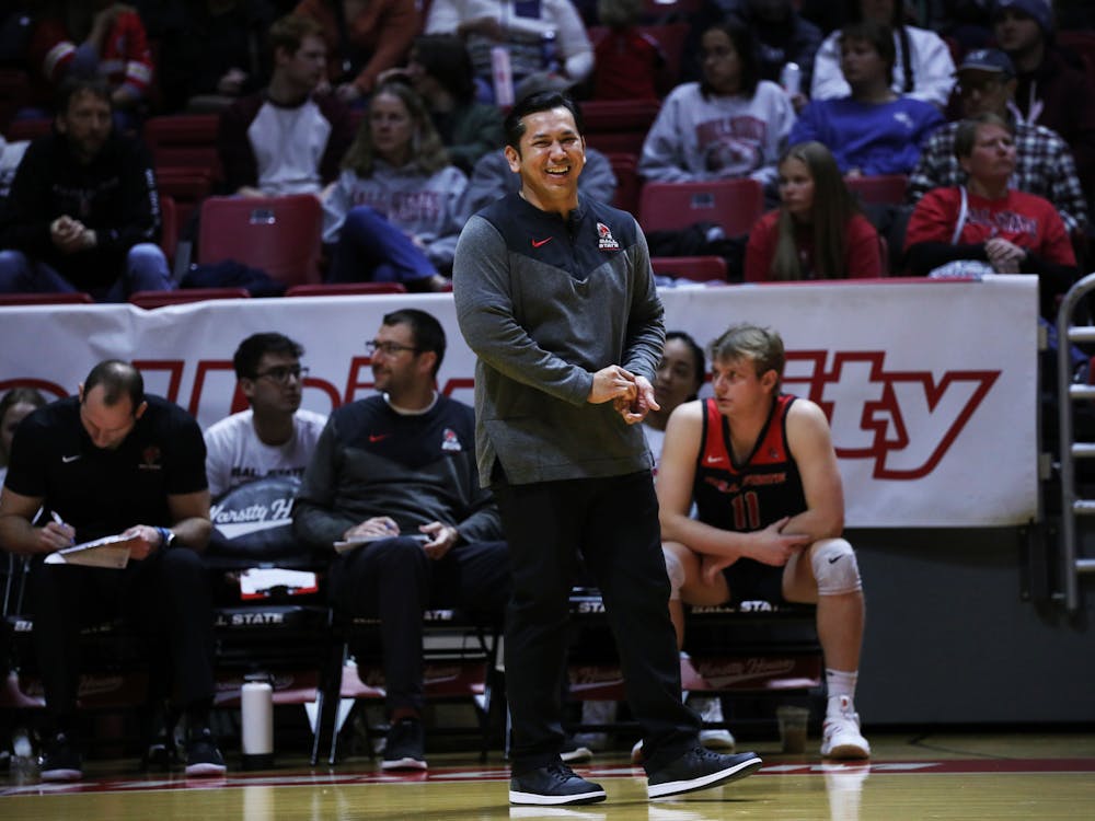 Ball State men's volleyball head coach Donan Cruz smiles after talking to a player against Tusculum Jan. 13 at Worthen Arena. The Cardinals won 3-0 against the Pioneers. Mya Cataline, DN