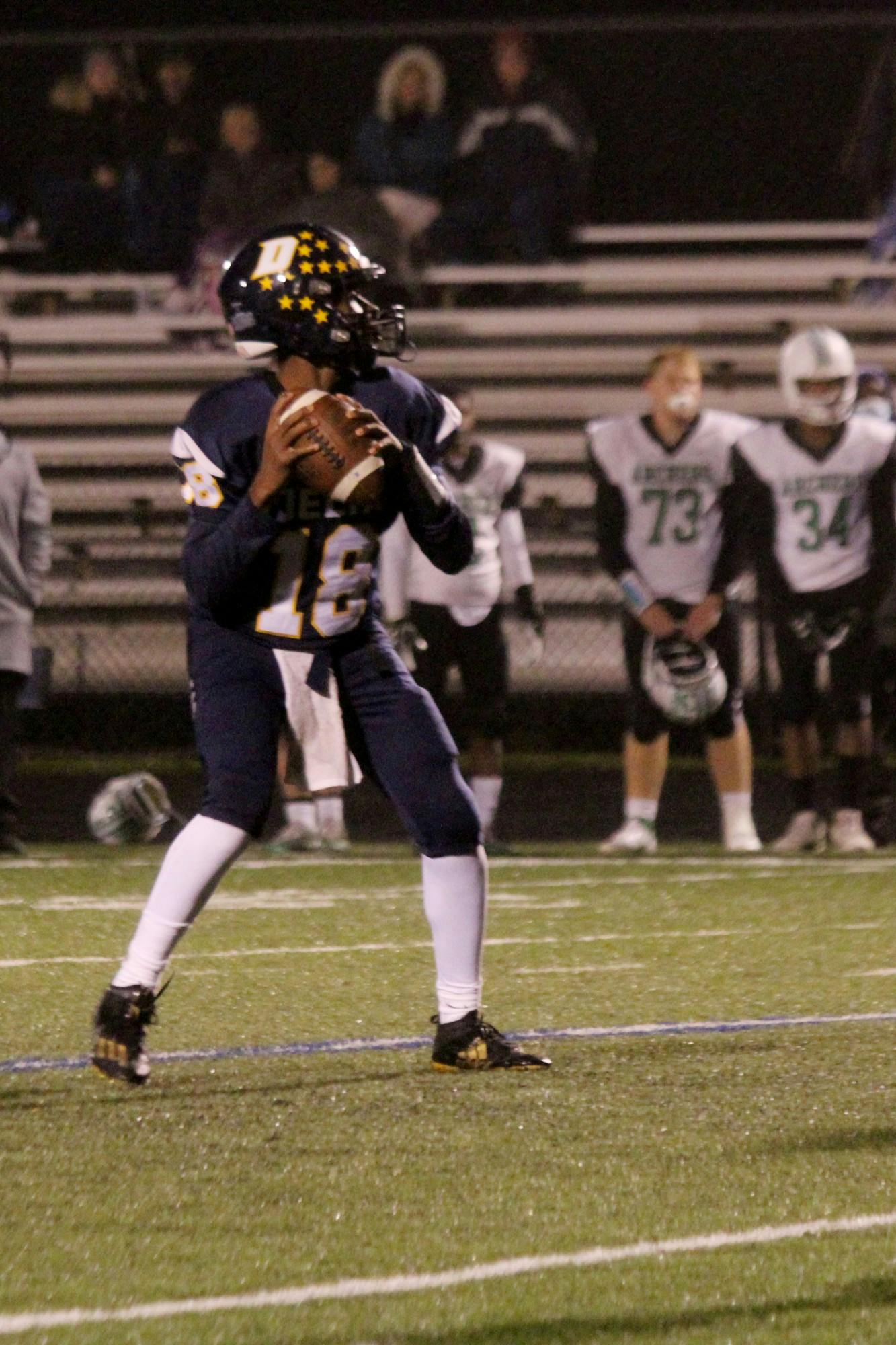 The quarterback for the Delta High School football team throws a pass further down the field on Oct. 22, 2021, at Delta High School in Muncie, IN. Amber Pietz, DN