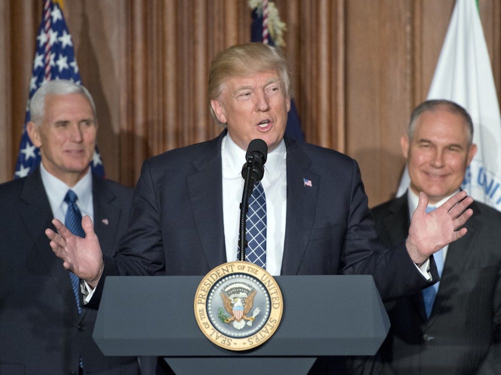 President Donald Trump makes remarks prior to signing an Energy Independence Executive Order at the Environmental Protection Agency headquarters in Washington, D.C., on Thursday, March 28, 2017. Vice President Mike Pence, left, and EPA Administrator Scott Pruitt, right, look on. (Ron Sachs/CNP/Pool/Sipa USA/TNS)