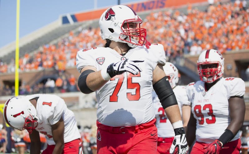 Ball State offensive lineman Vinnie Palazeti leads the team's captains onto the field before their match against the University of Illinois on Sept. 2, 2017. Ball State hosts UAB Saturday for their first home game. Robby General, DN