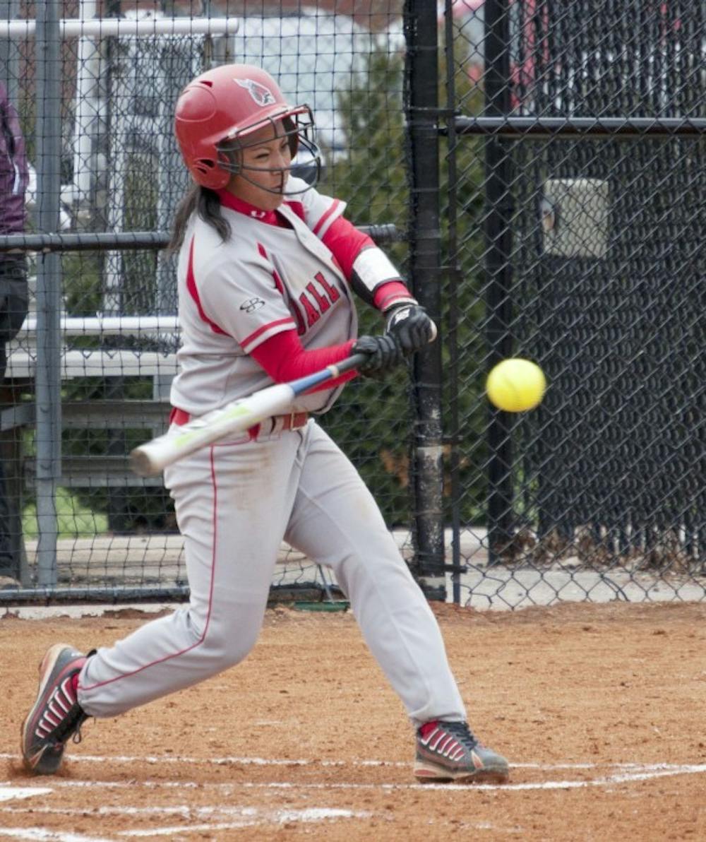 Junior Alison Mercado connects with a pitch against Dayton in the home opener. DN PHOTO DYLAN BUELL