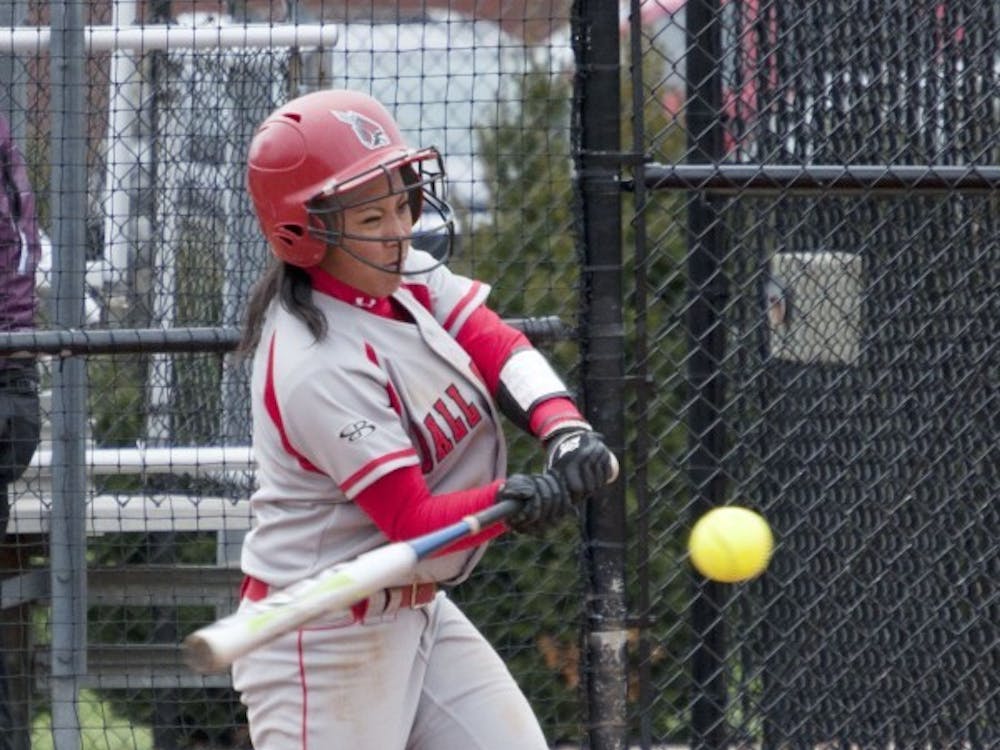 Junior Alison Mercado connects with a pitch against Dayton in the home opener. DN PHOTO DYLAN BUELL