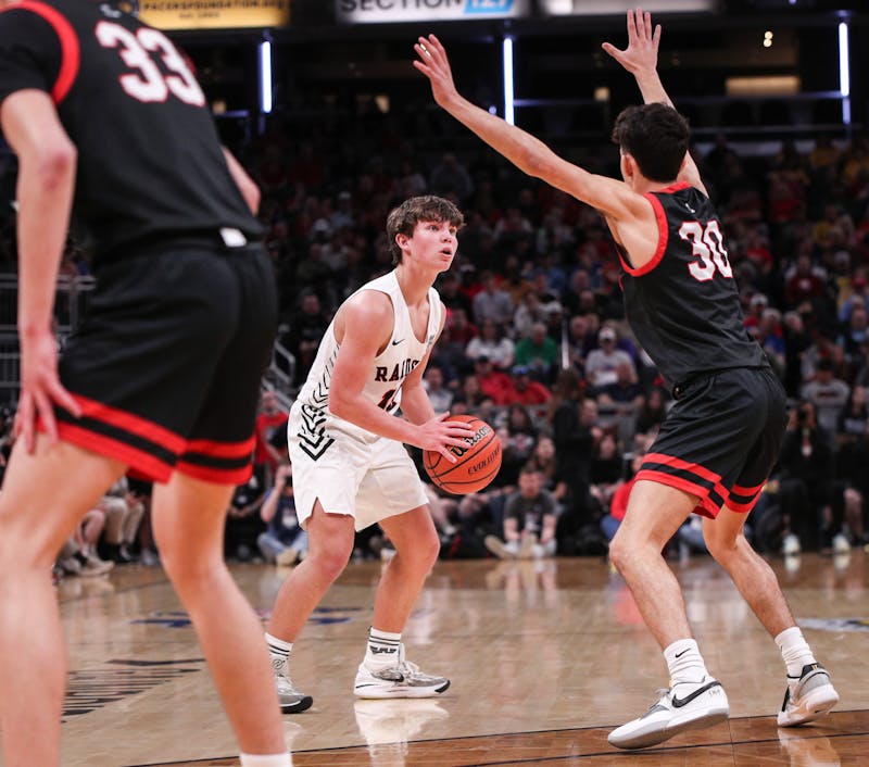 Junior guard Nate Luce looks for an option against Brownstown Central March 30 at IHSAA State Finals at Gainbridge Fieldhouse in Indianapolis. Andrew Berger, DN