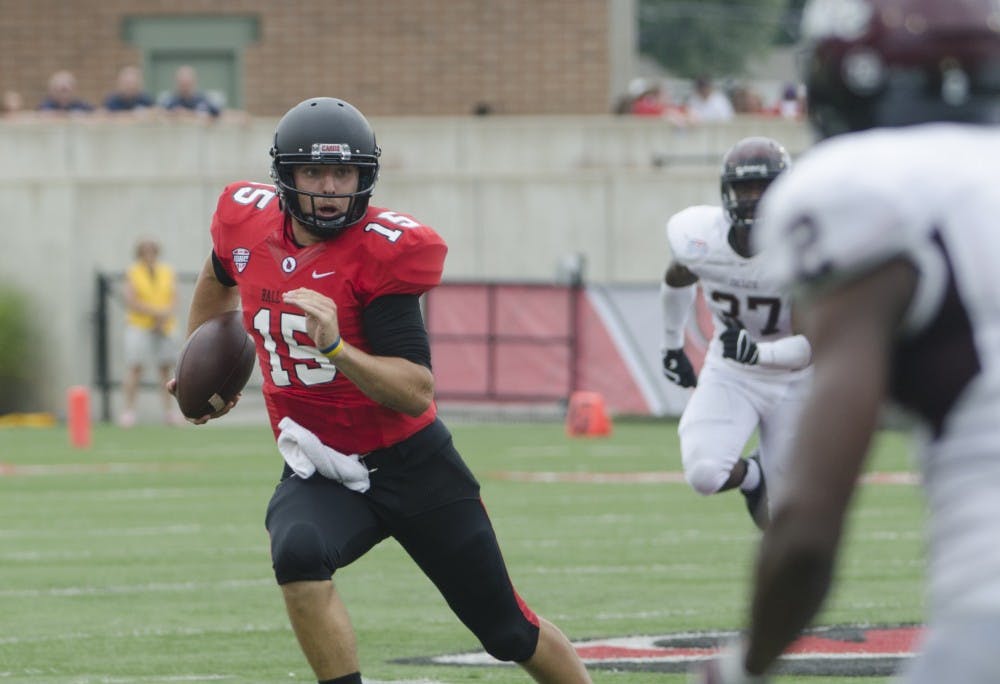 Redshirt sophomore quarterback Ozzie Mann runs the ball during the game against Colgate on Aug. 30 at Scheumann Stadium. DN FILE PHOTO BREANNA DAUGHERTY 