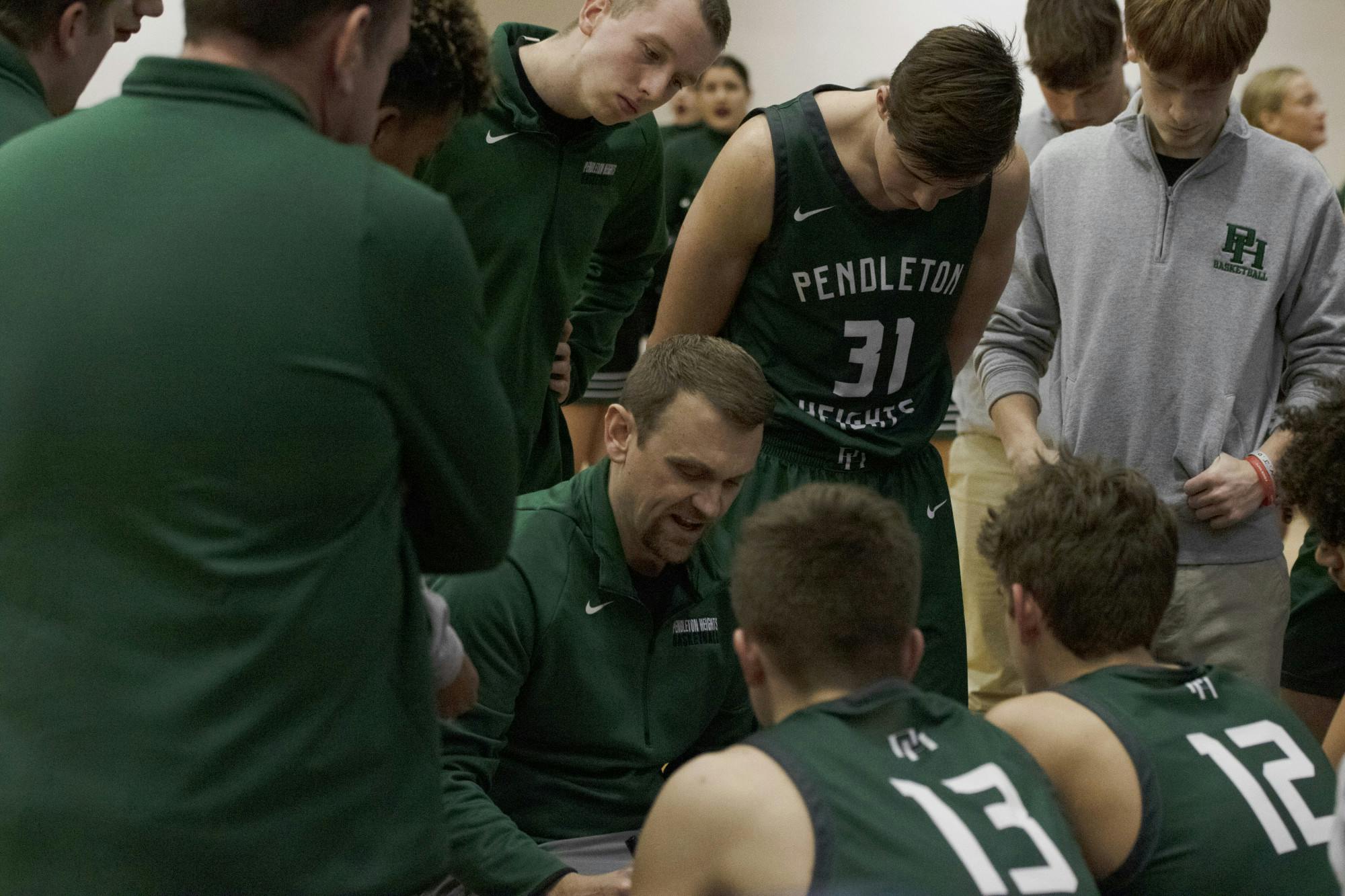 Pendleton Heights head coach Adam Ballard coaches his team during a timeout Jan. 20 at Delta High School in Muncie, Ind. Zach Carter DN 