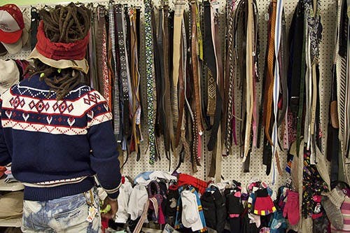 Algier Williamson searches among the shelves at Goodwill. Williamson goes thrift shopping almost every weekend for three hours at a time. DN PHOTO CHELSEA MEAD